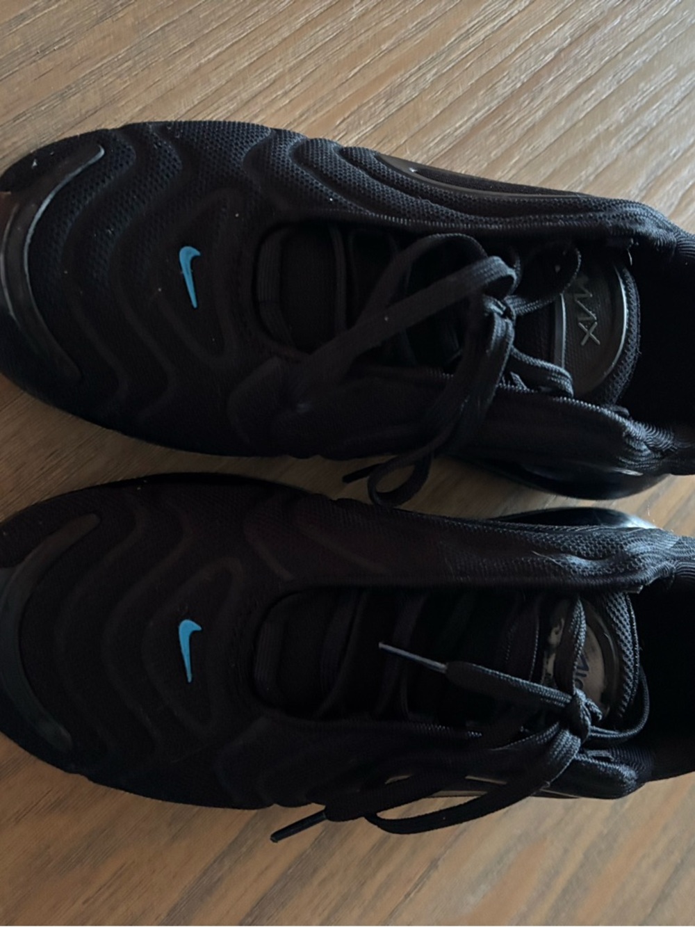 Nike Black Sneakers with Blue Swoosh Accent